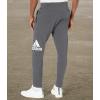 imageadidas Mens Essentials Logo Tapered Badge SweatpantsDark Grey Heather