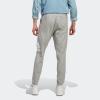 imageadidas Mens Essentials Logo Tapered Badge SweatpantsMedium Grey Heather