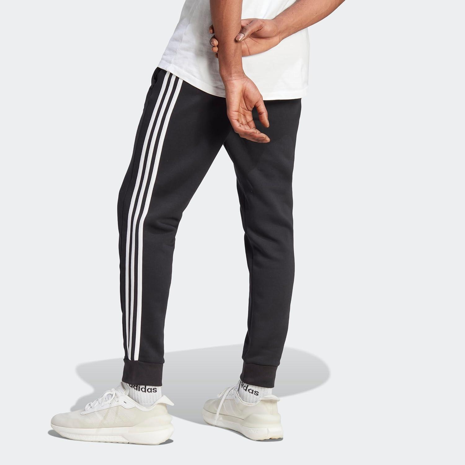 imageadidas Mens Essentials Fleece Tapered Cuff 3Stripes PantsBlack  White