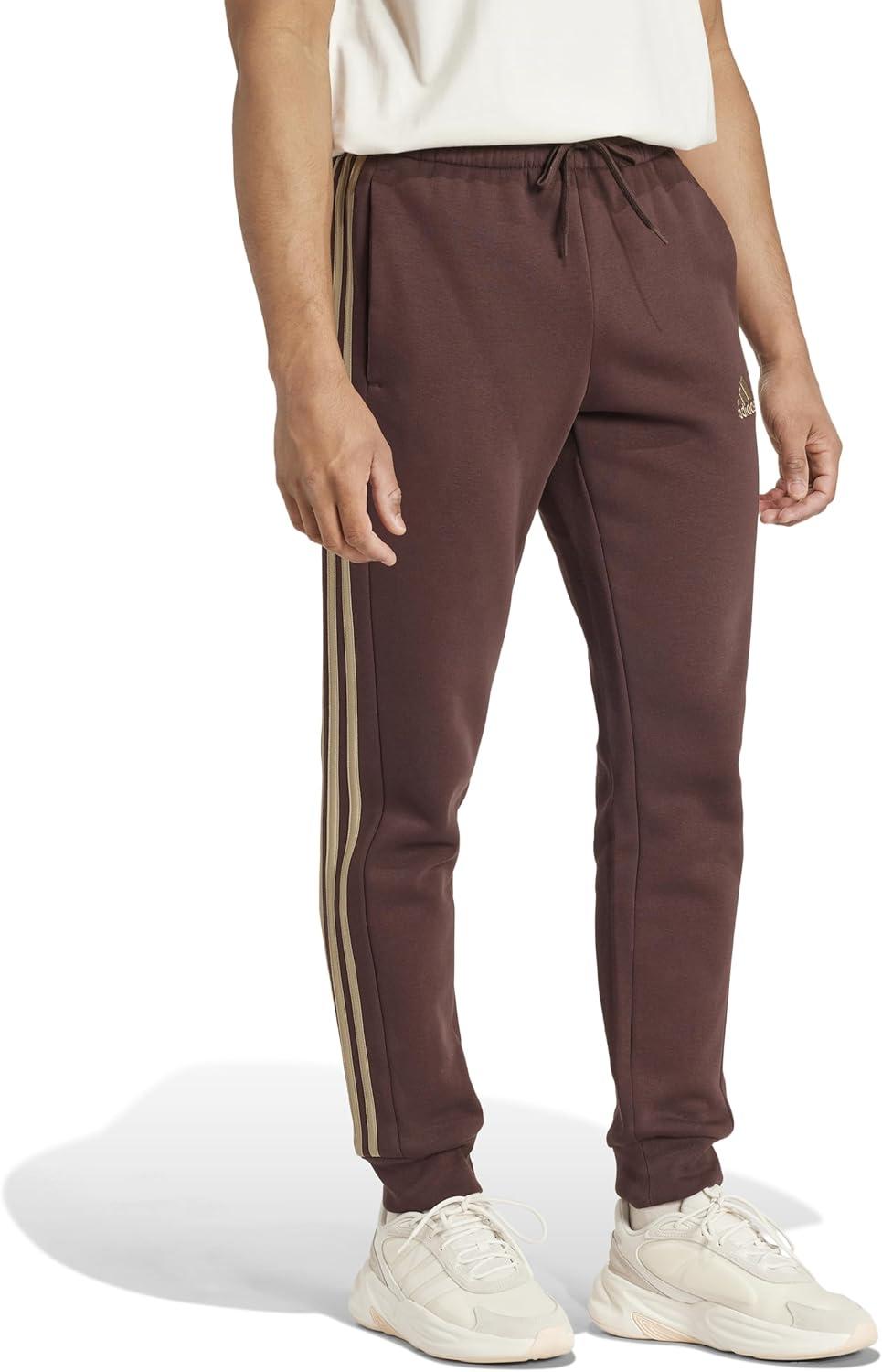 imageadidas Mens Essentials Fleece Tapered Cuff 3Stripes PantsShadow Brown