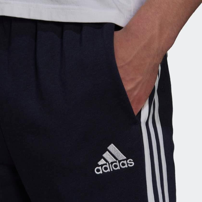 imageadidas Mens Essentials Fleece Tapered Elastic Cuff 3Stripes PantsLegend Ink