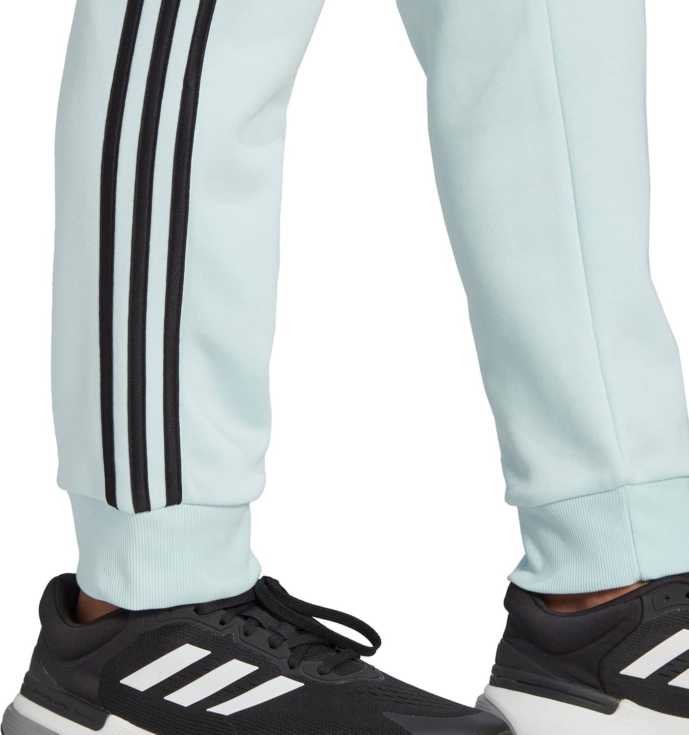 imageadidas Mens Essentials 3Stripes Fleece Tapered Cuff PantsAlmost BlueBlack
