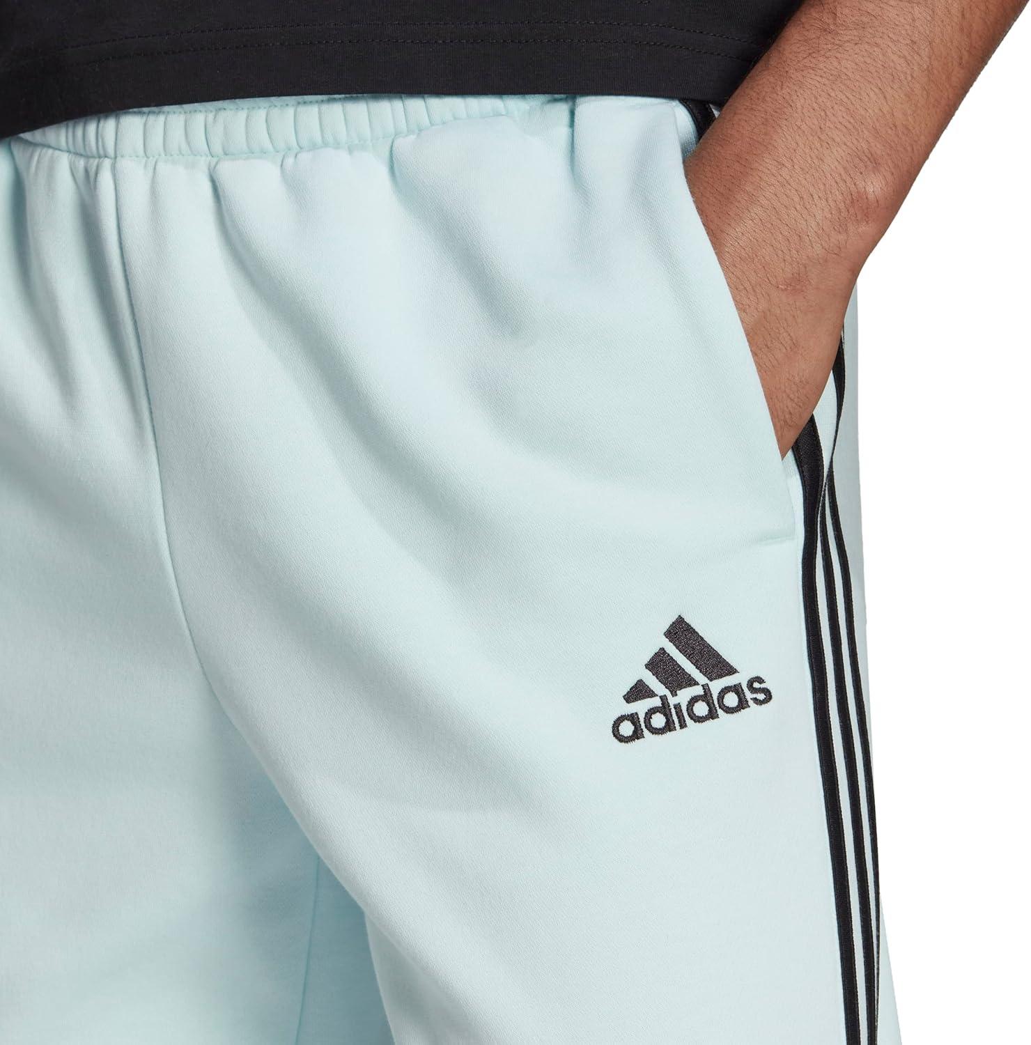 imageadidas Mens Essentials 3Stripes Fleece Tapered Cuff PantsAlmost BlueBlack