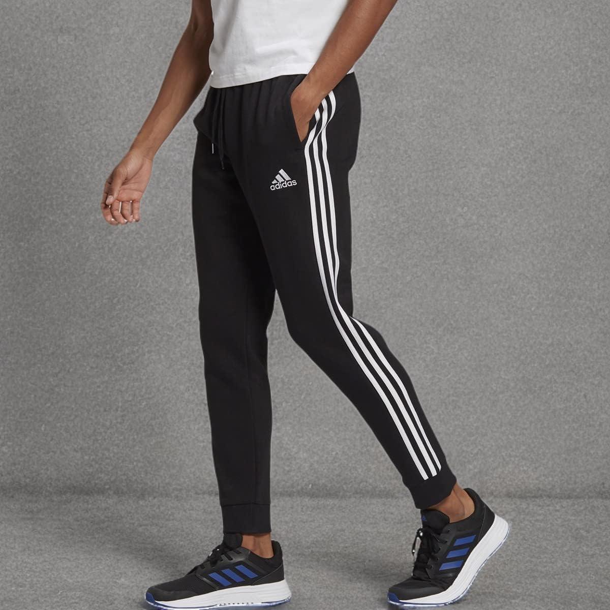 imageadidas Mens Essentials 3Stripes Fleece Tapered Cuff PantsBlack  White