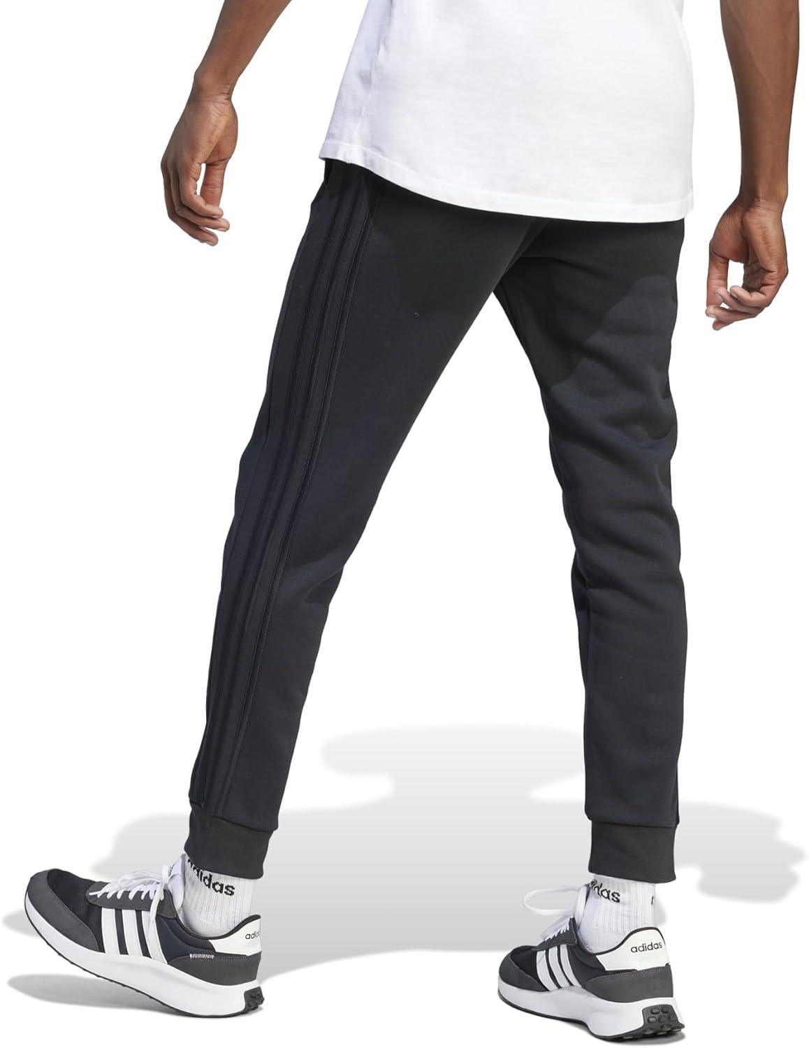 imageadidas Mens Essentials 3Stripes Fleece Tapered Cuff PantsBlack