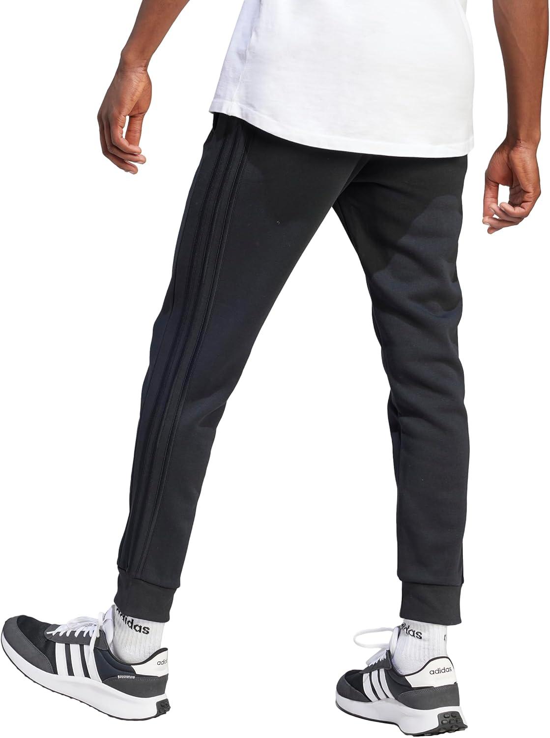imageadidas Mens Essentials 3Stripes Fleece Tapered Cuff PantsBlackBlack