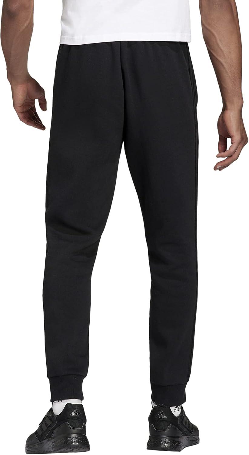 imageadidas Mens Essentials 3Stripes Fleece Tapered Cuff PantsBlackBlackBlack