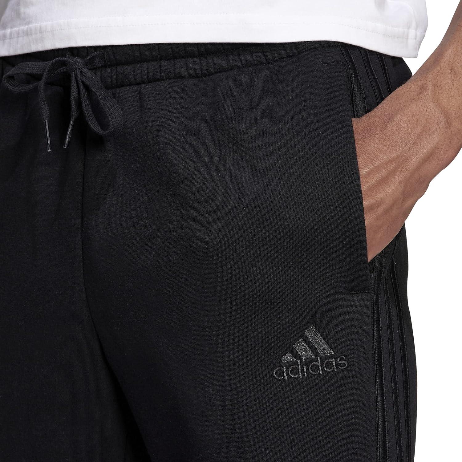 imageadidas Mens Essentials 3Stripes Fleece Tapered Cuff PantsBlackBlackBlack