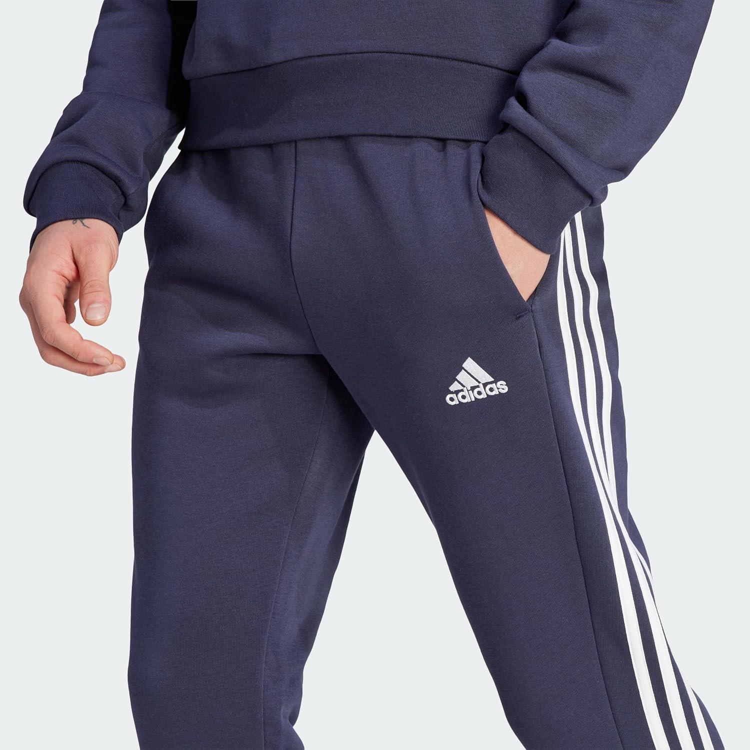 imageadidas Mens Essentials 3Stripes Fleece Tapered Cuff PantsInk