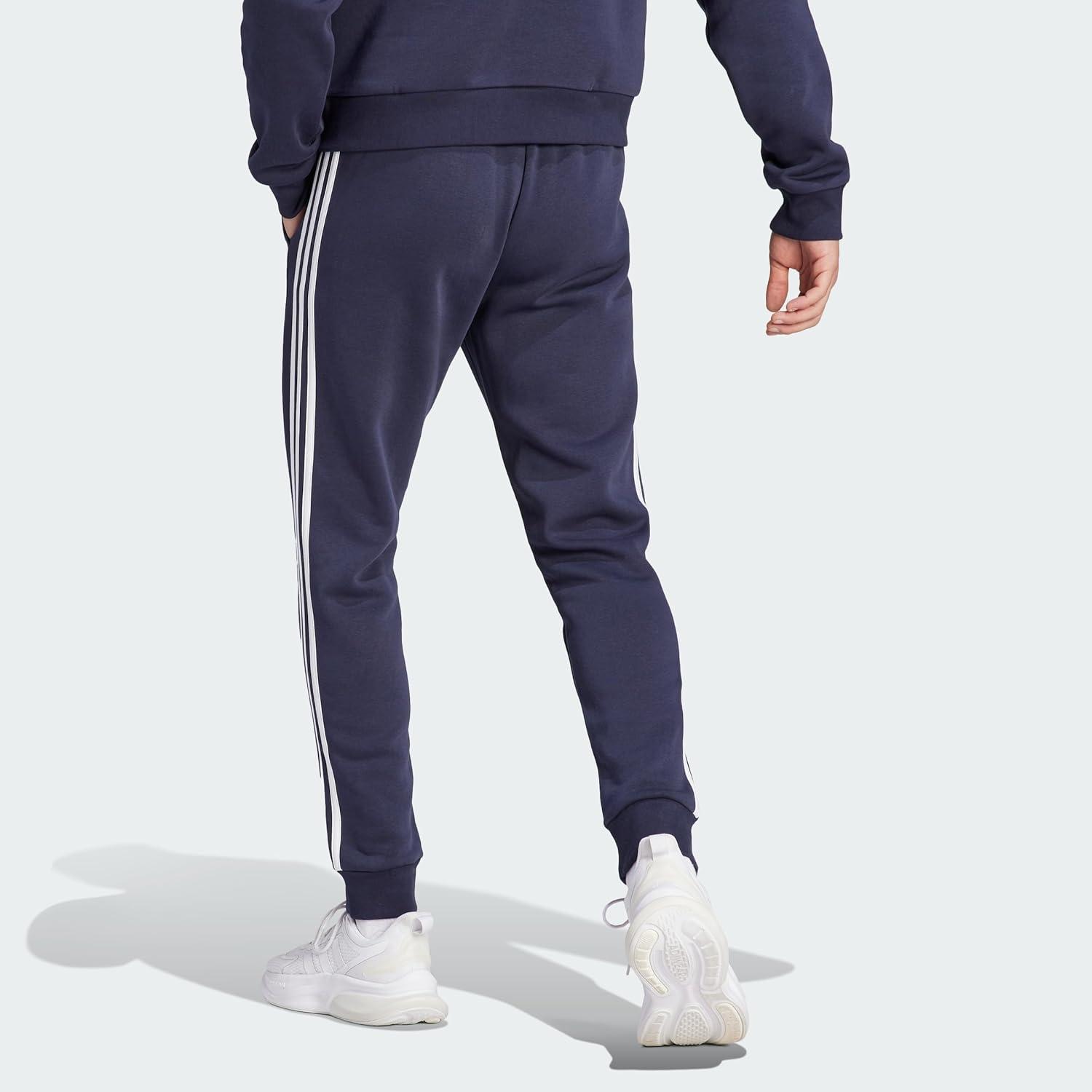 imageadidas Mens Essentials 3Stripes Fleece Tapered Cuff PantsInk