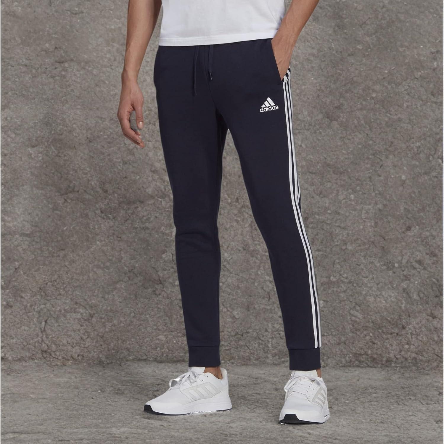 imageadidas Mens Essentials 3Stripes Fleece Tapered Cuff PantsLegend InkWhite