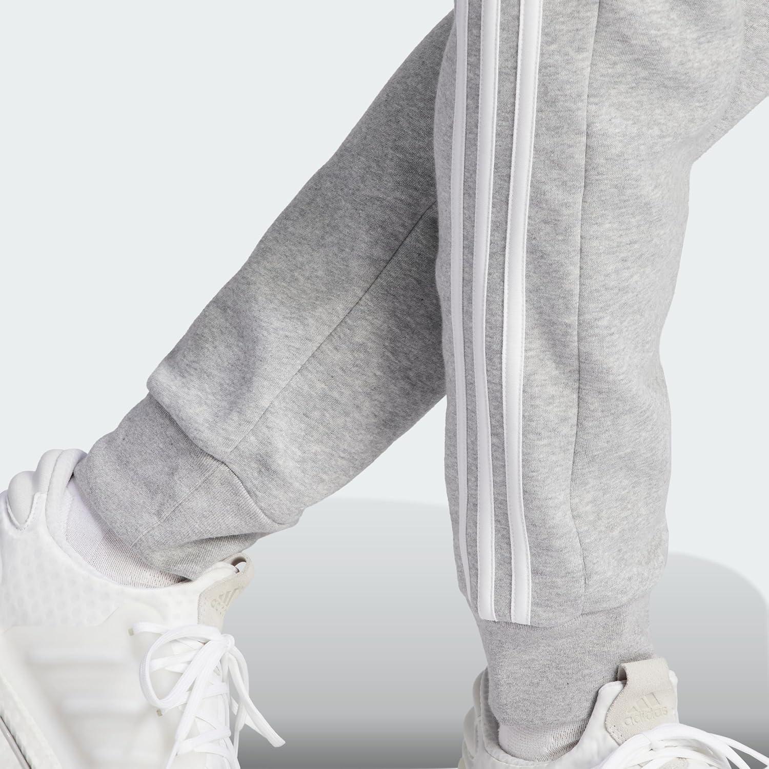 imageadidas Mens Essentials 3Stripes Fleece Tapered Cuff PantsMedium Grey Heather