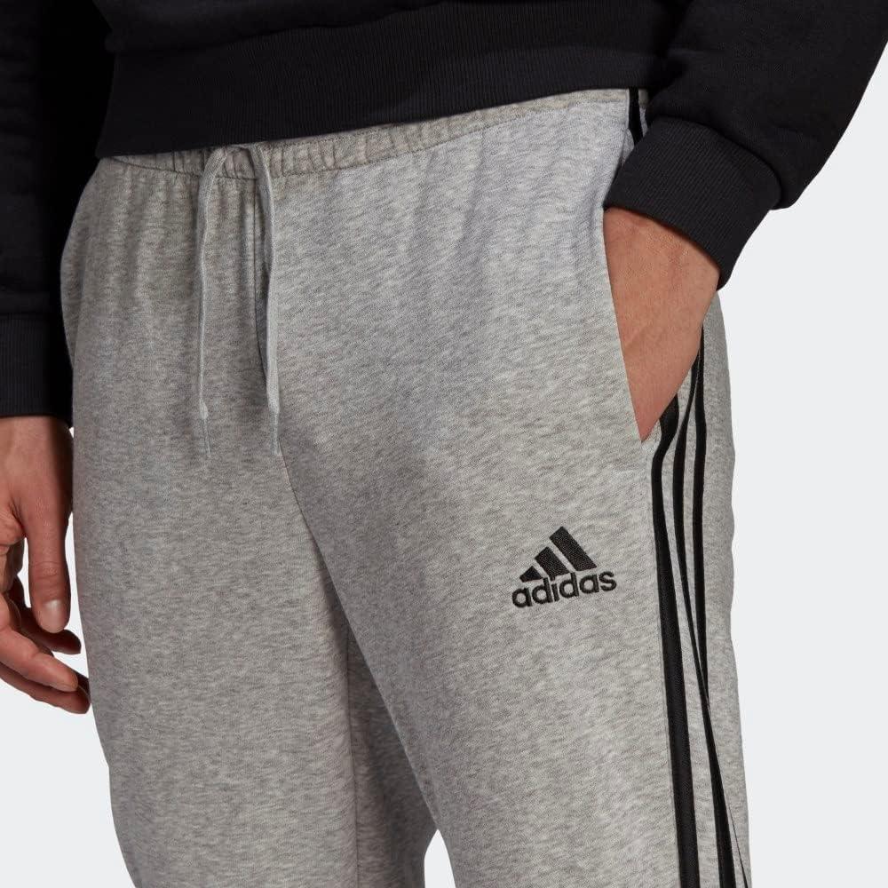 imageadidas Mens Essentials 3Stripes Fleece Tapered Cuff PantsMedium Grey HeatherBlack