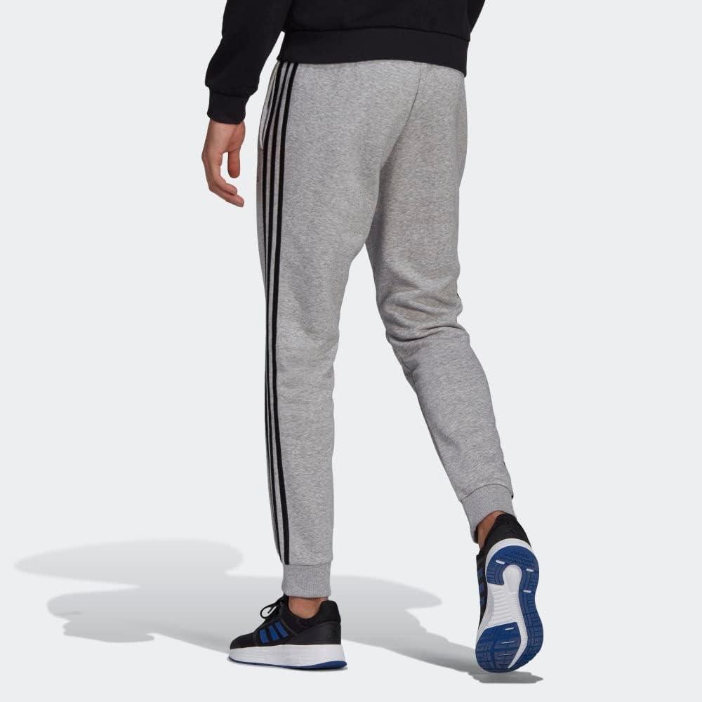 imageadidas Mens Essentials 3Stripes Fleece Tapered Cuff PantsMedium Grey HeatherBlack