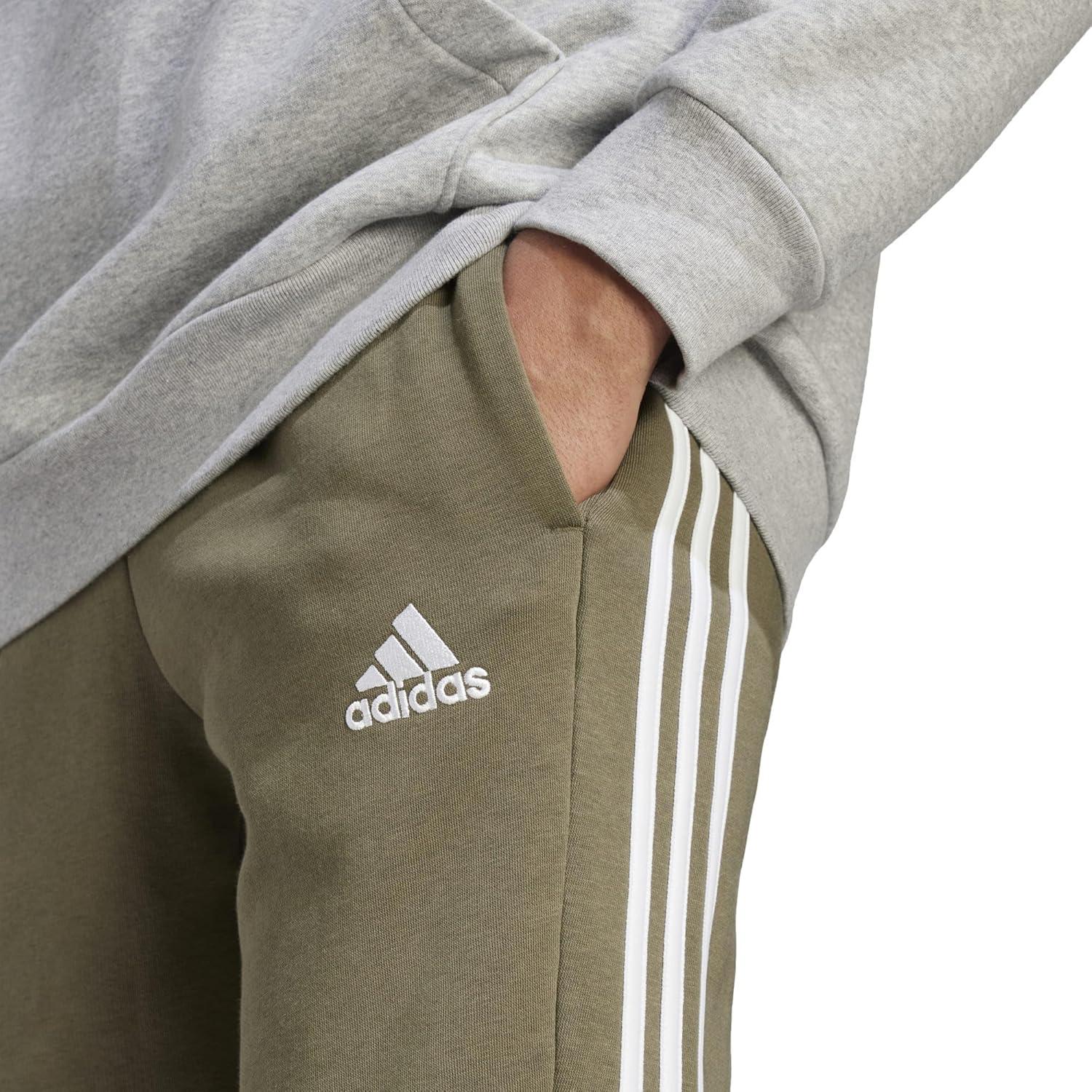 imageadidas Mens Essentials 3Stripes Fleece Tapered Cuff PantsOlive Strata