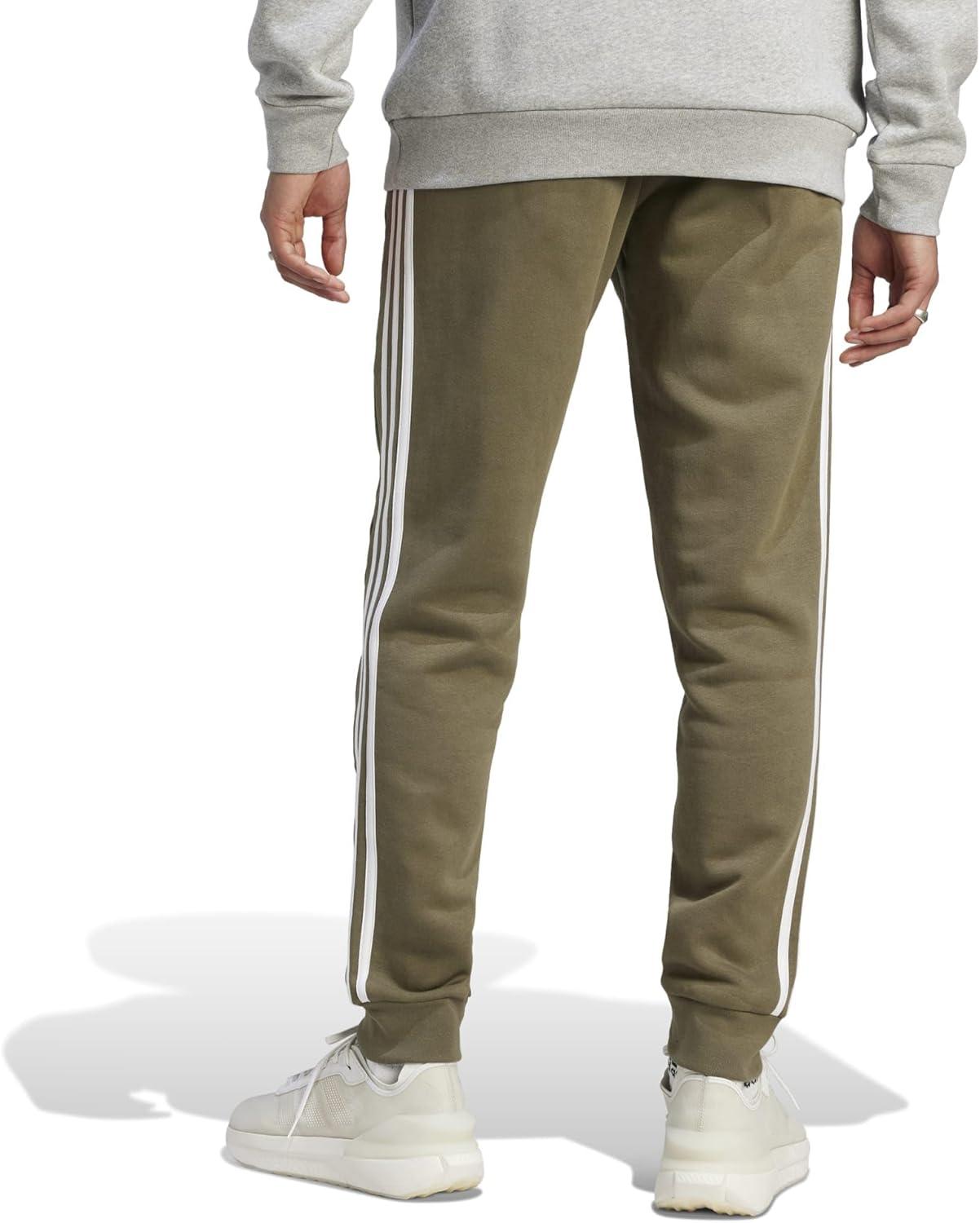 imageadidas Mens Essentials 3Stripes Fleece Tapered Cuff PantsOlive Strata