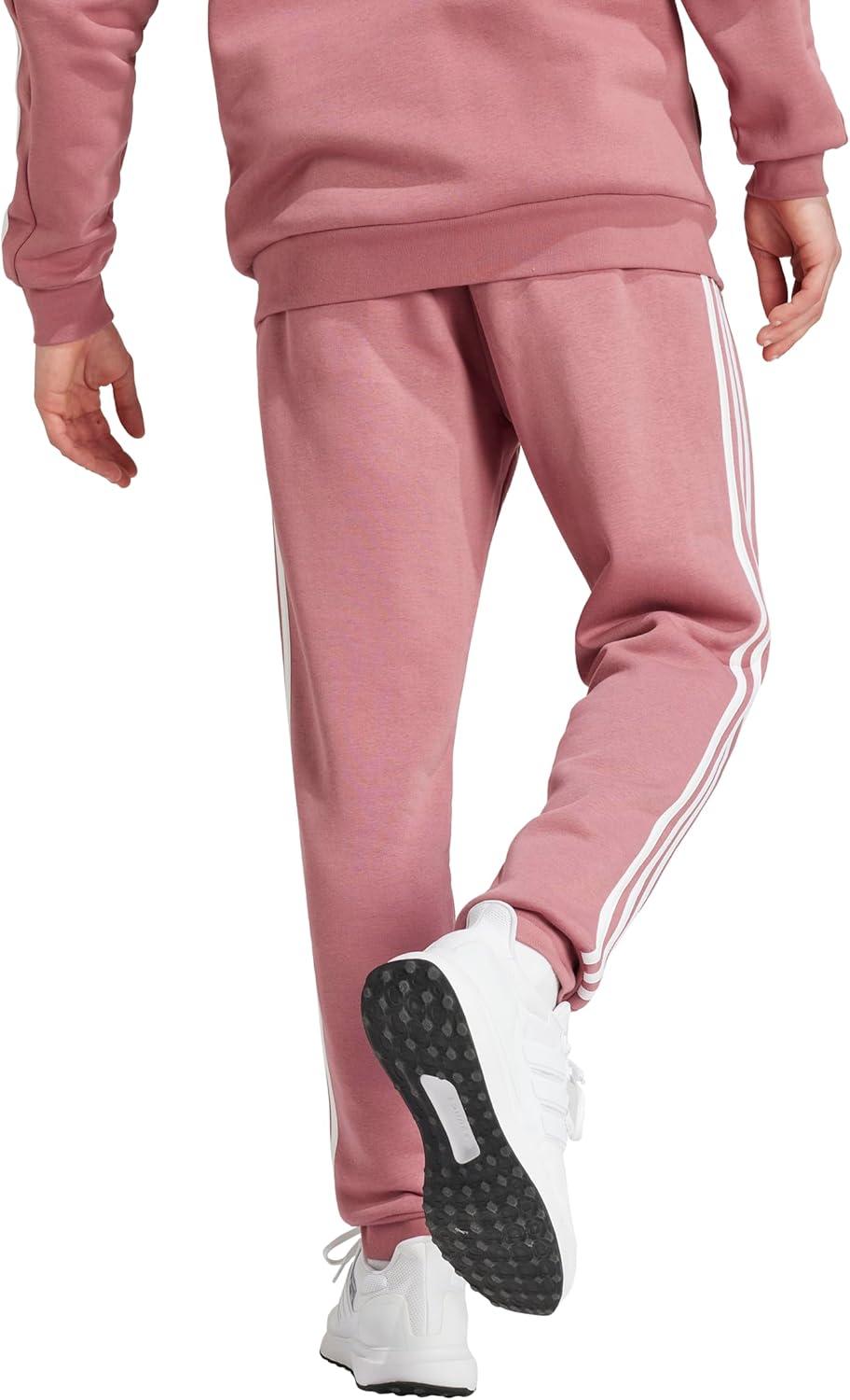 imageadidas Mens Essentials 3Stripes Fleece Tapered Cuff PantsPreloved Crimson