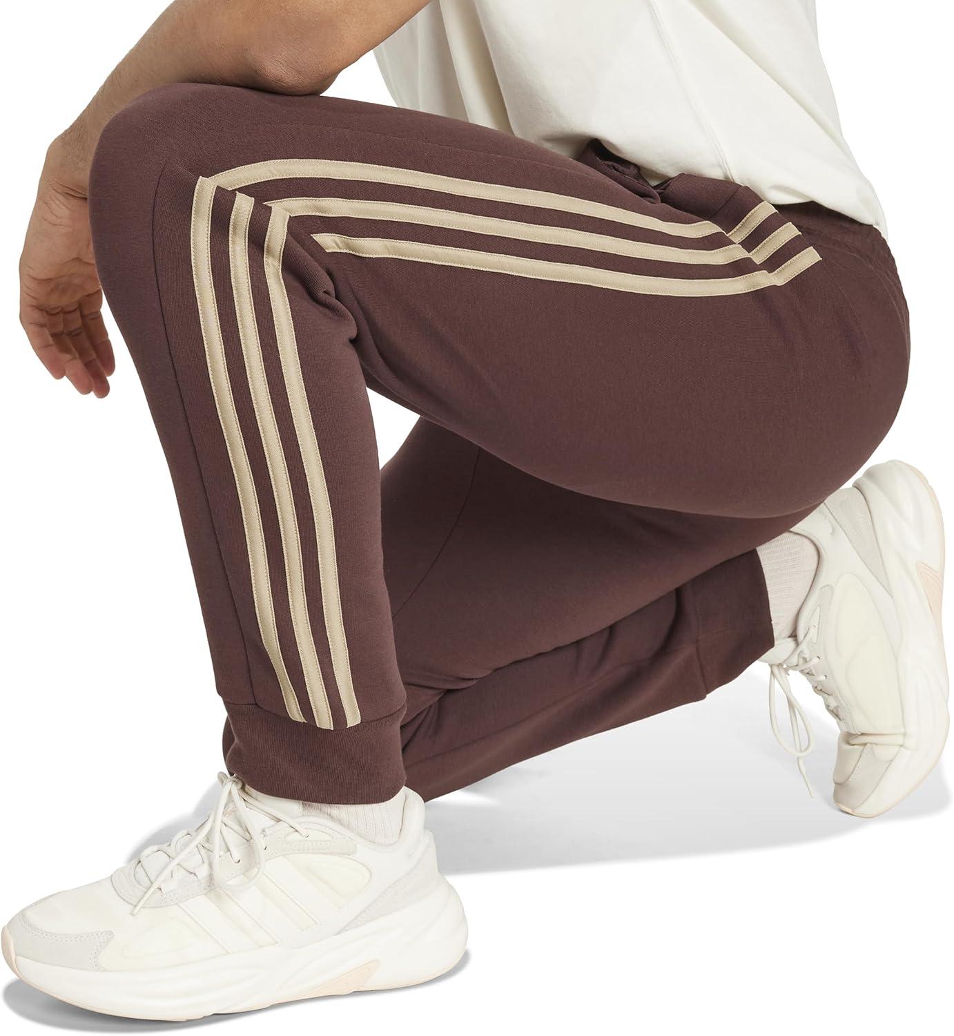 imageadidas Mens Essentials 3Stripes Fleece Tapered Cuff PantsShadow Brown