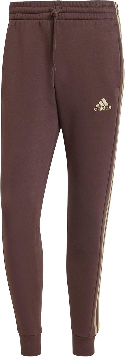 imageadidas Mens Essentials 3Stripes Fleece Tapered Cuff PantsShadow Brown
